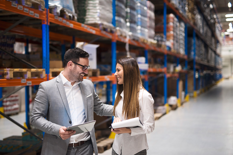 warehouse-managers-visiting-large-warehouse-checking-distribution